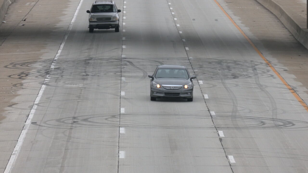 Black rubber tire marks on I-264 near Muhammad Ali International Airport